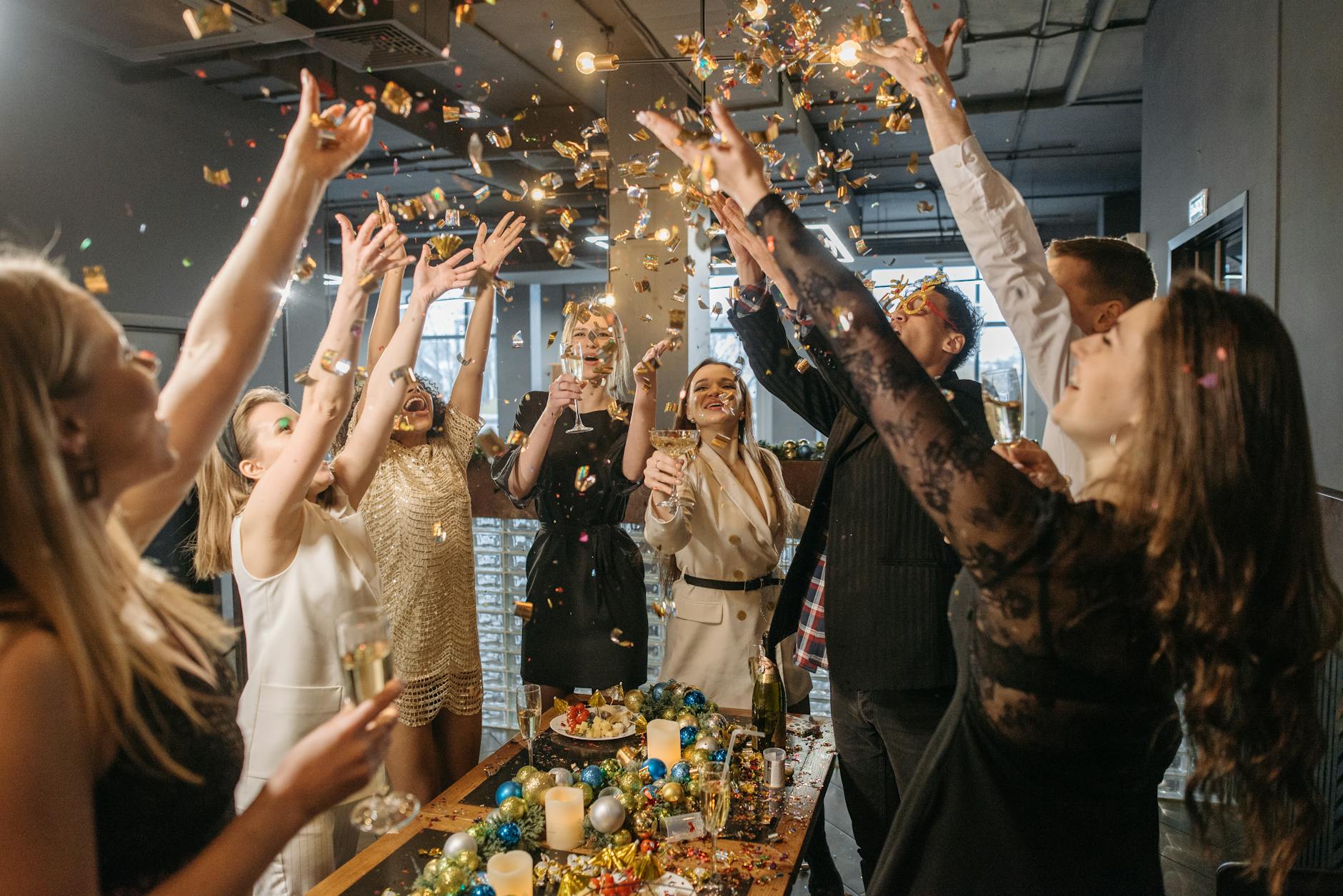 group of people tossing confetti